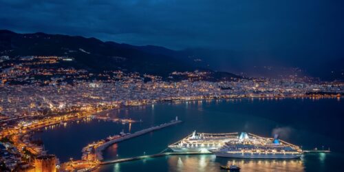 spectacular night sea coast with city cruise ship lights reflected water scaled